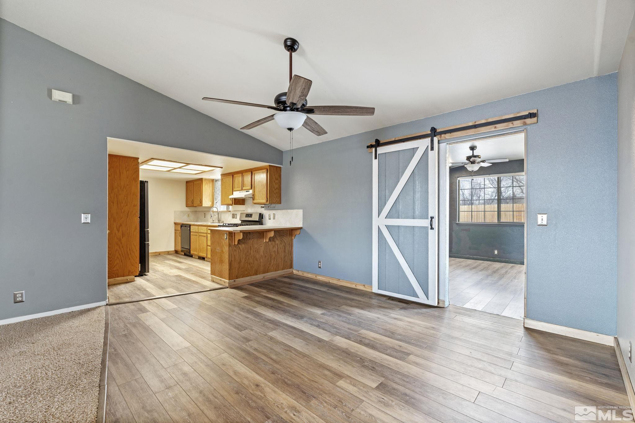 1240 Lattin Road Fallon, NV 89406 - Photo 11 of 34 a view of a kitchen with wooden floor a sink and a window