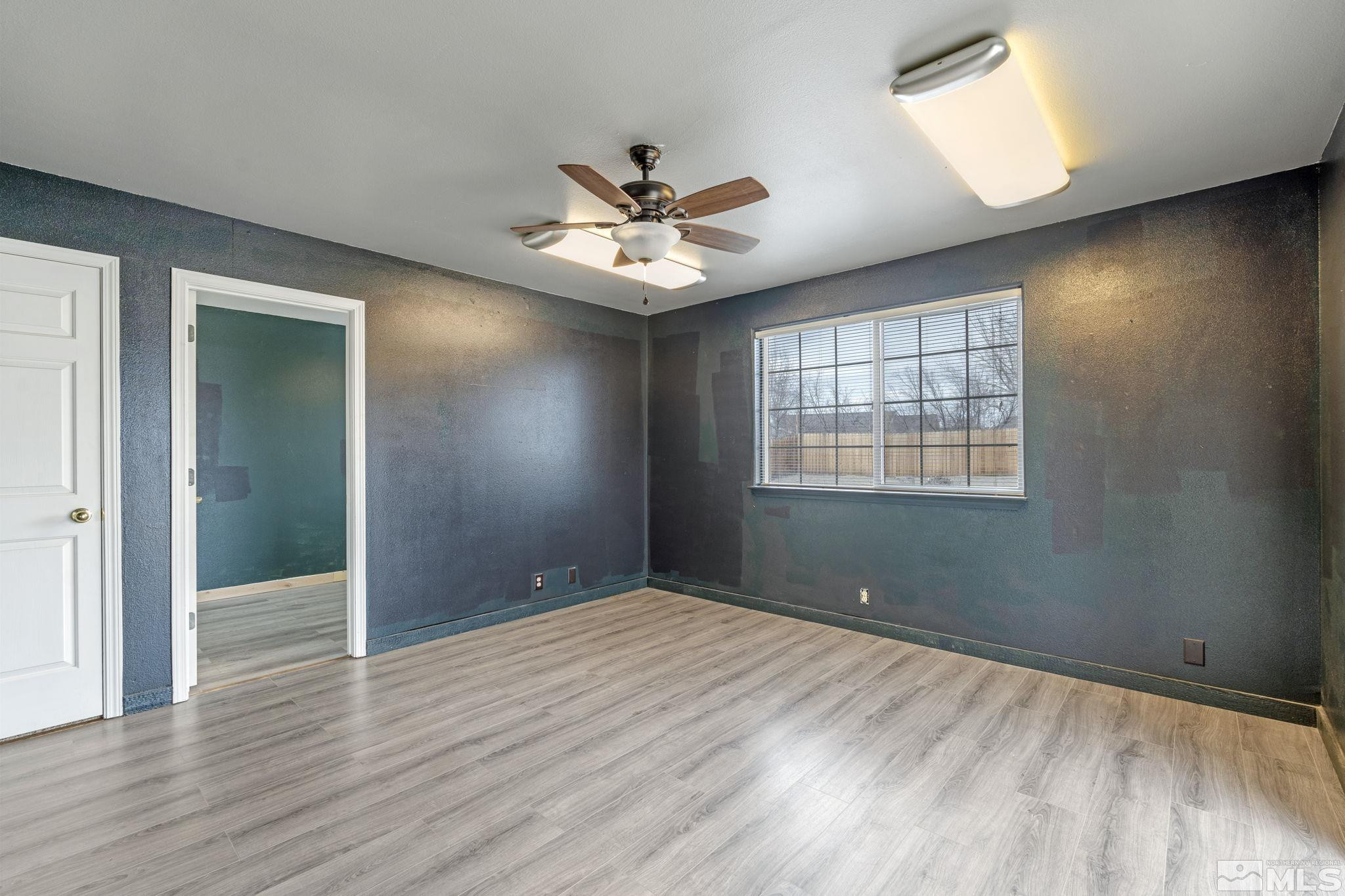 1240 Lattin Road Fallon, NV 89406 - Photo 21 of 34 wooden floor in an empty room with a window