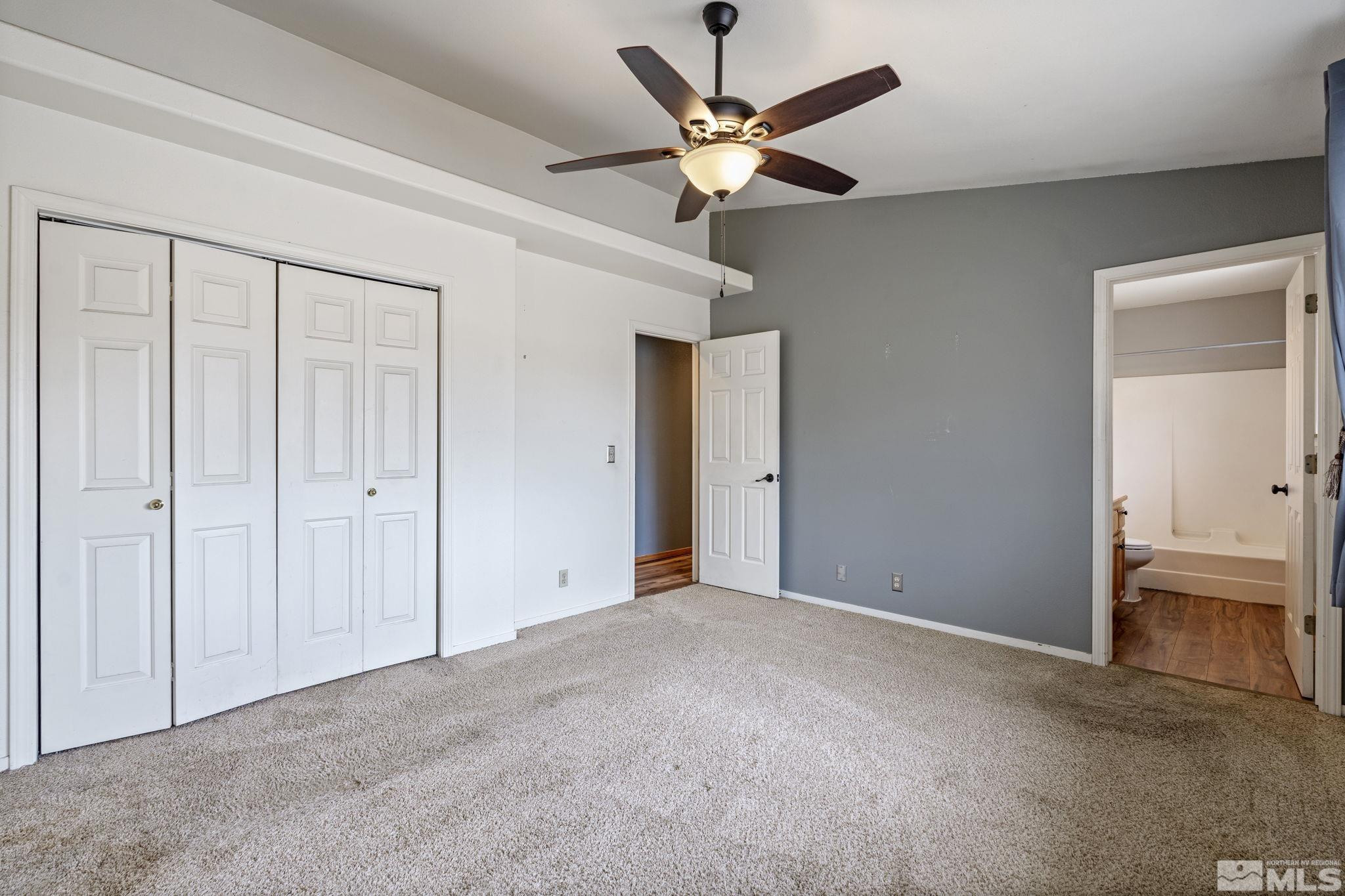 1240 Lattin Road Fallon, NV 89406 - Photo 25 of 34 an empty room with closet and a ceiling fan