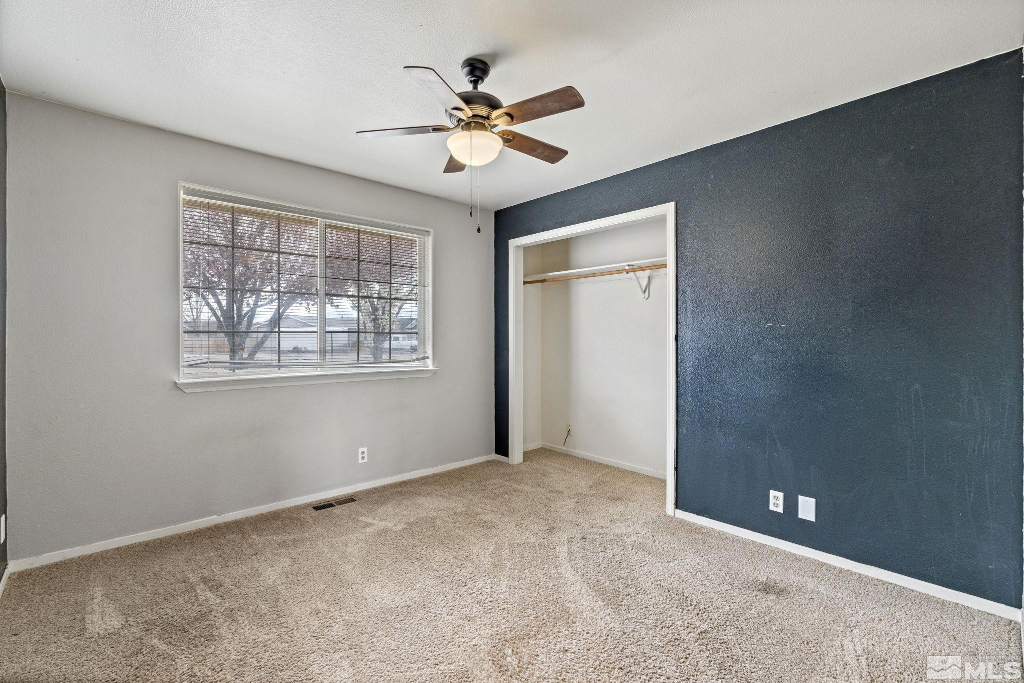 1240 Lattin Road Fallon, NV 89406 - Photo 29 of 34 a view of an empty room with a ceiling fan