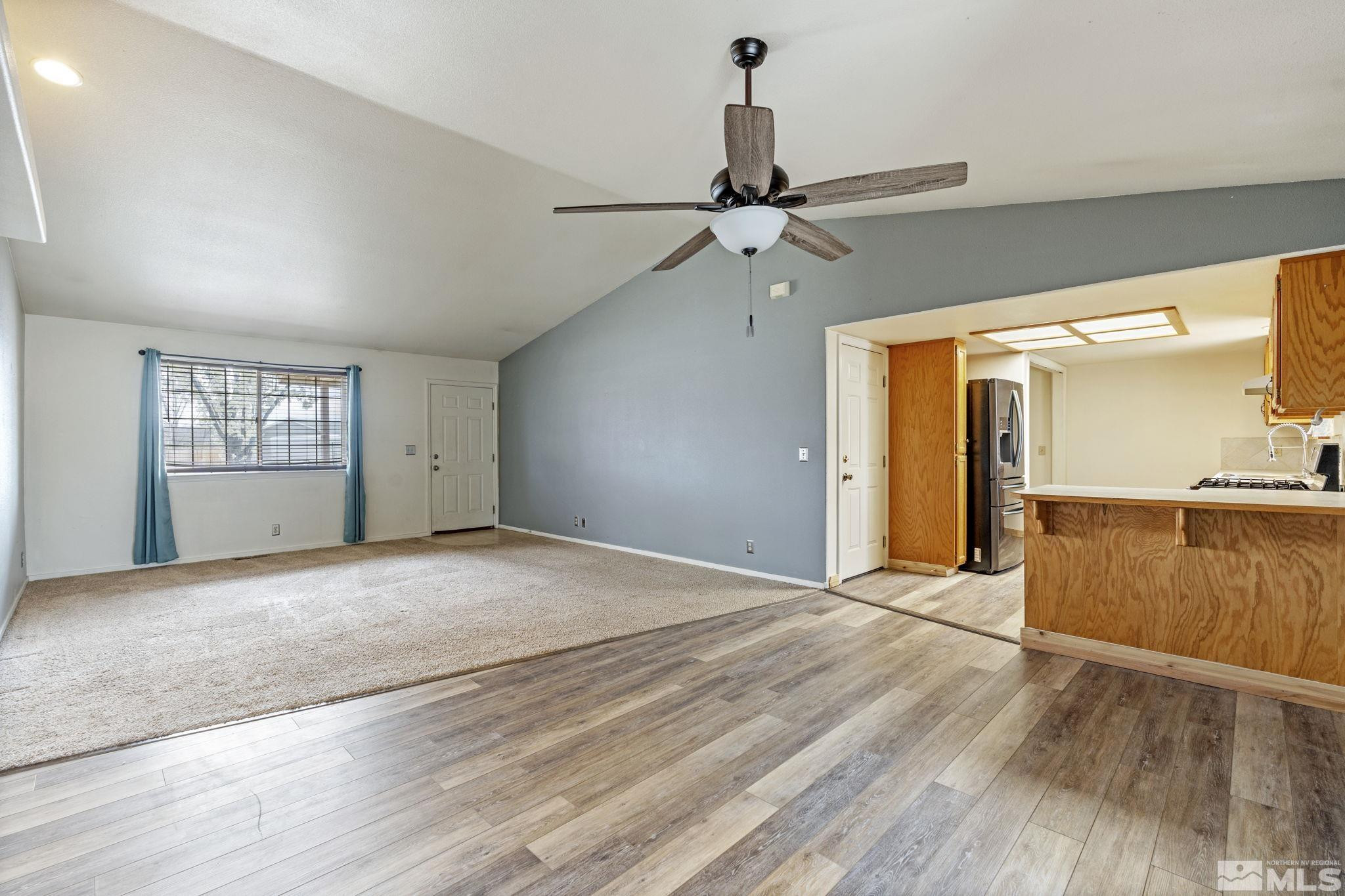 1240 Lattin Road Fallon, NV 89406 - Photo 9 of 34 a view of empty room with wooden floor and fan