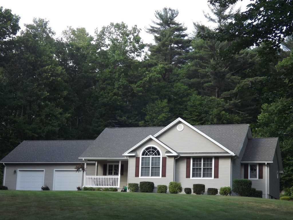78 Bogan Road Monson, MA 01057 - Photo 1 of 20 a front view of a house with a garden