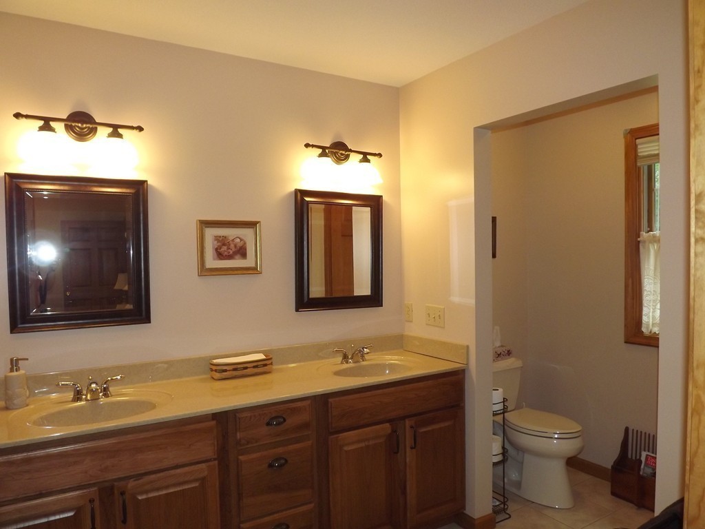 78 Bogan Road Monson, MA 01057 - Photo 13 of 20 a bathroom with a granite countertop sink toilet and mirror