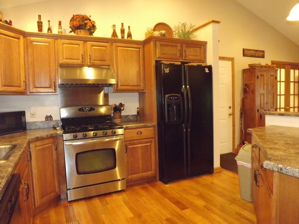 78 Bogan Road Monson, MA 01057 - Photo 4 of 20 a kitchen with stainless steel appliances granite countertop a refrigerator stove and sink