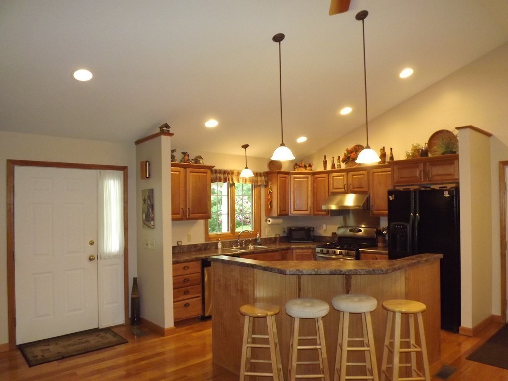 78 Bogan Road Monson, MA 01057 - Photo 7 of 20 a kitchen with a refrigerator a sink and wooden floor