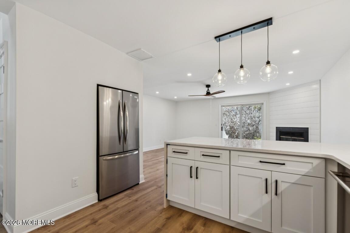 16 Shore Drive Long Branch, NJ 07740 - Photo 9 of 26 a kitchen with a refrigerator sink and cabinets