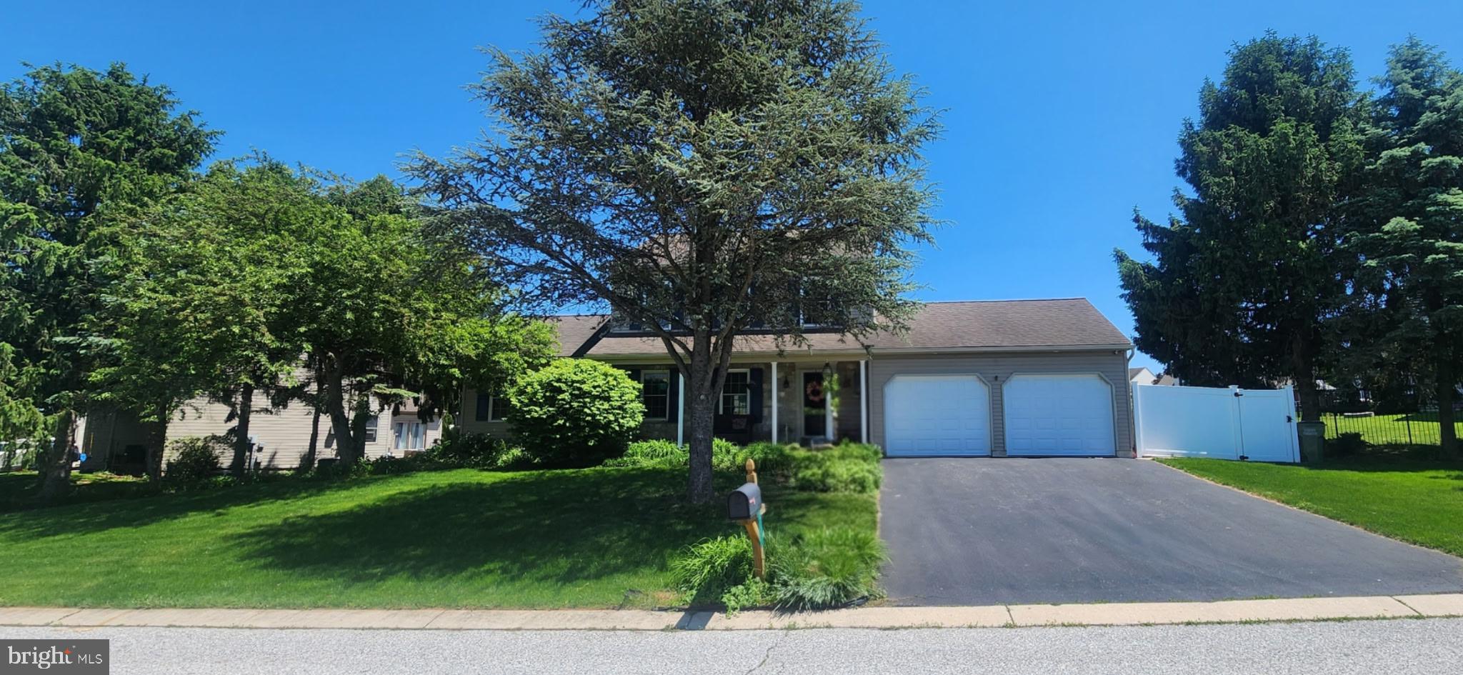 812 Kinross Avenue York, PA 17402 - Photo 29 of 29 a front view of a house with a garden and tree
