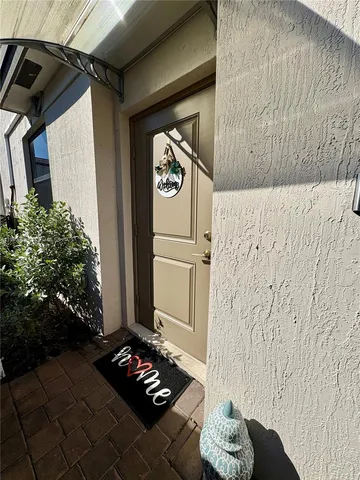 a view of a entryway door front of a house