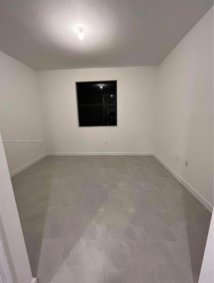 12950 Southwest 229th Lane, Unit 12950 Miami, FL 33170 - Photo 8 of 12 a view of an empty room