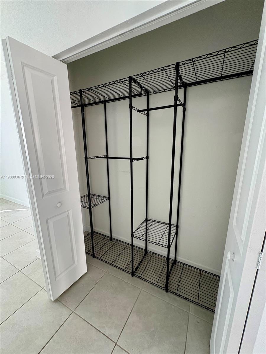 12950 Southwest 229th Lane, Unit 12950 Miami, FL 33170 - Photo 9 of 12 a view of a refrigerator in a storage