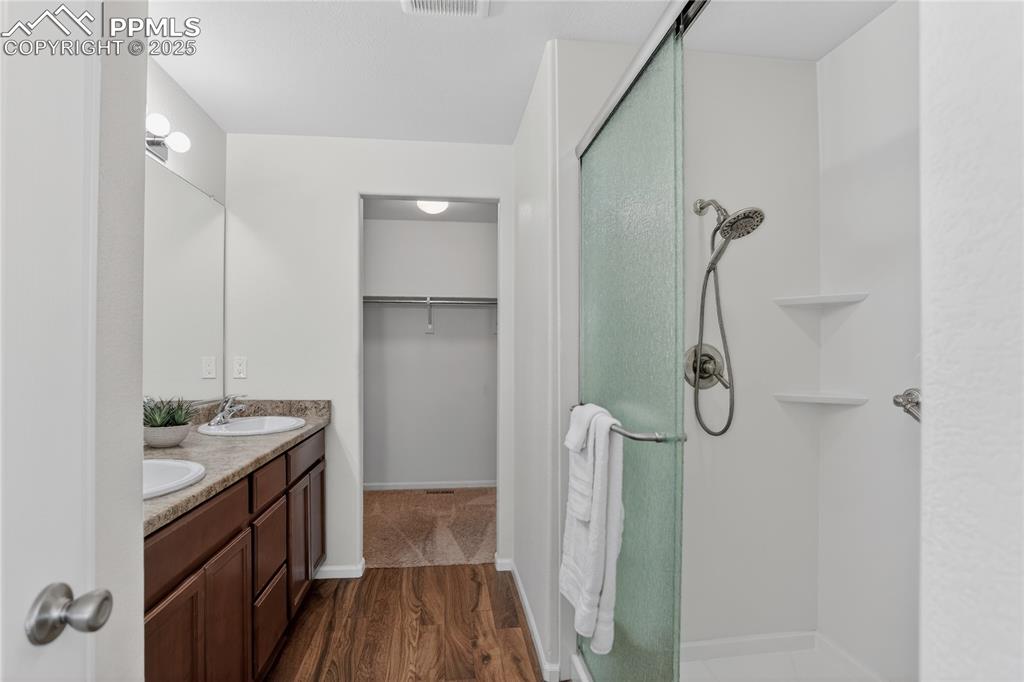 10179 Intrepid Way Colorado Springs, CO 80925 - Photo 11 of 20 Primary bath w/ dual sink vanity