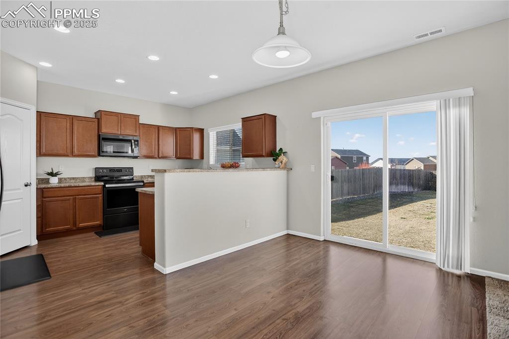 10179 Intrepid Way Colorado Springs, CO 80925 - Photo 5 of 20 Dining area w/ walk-out