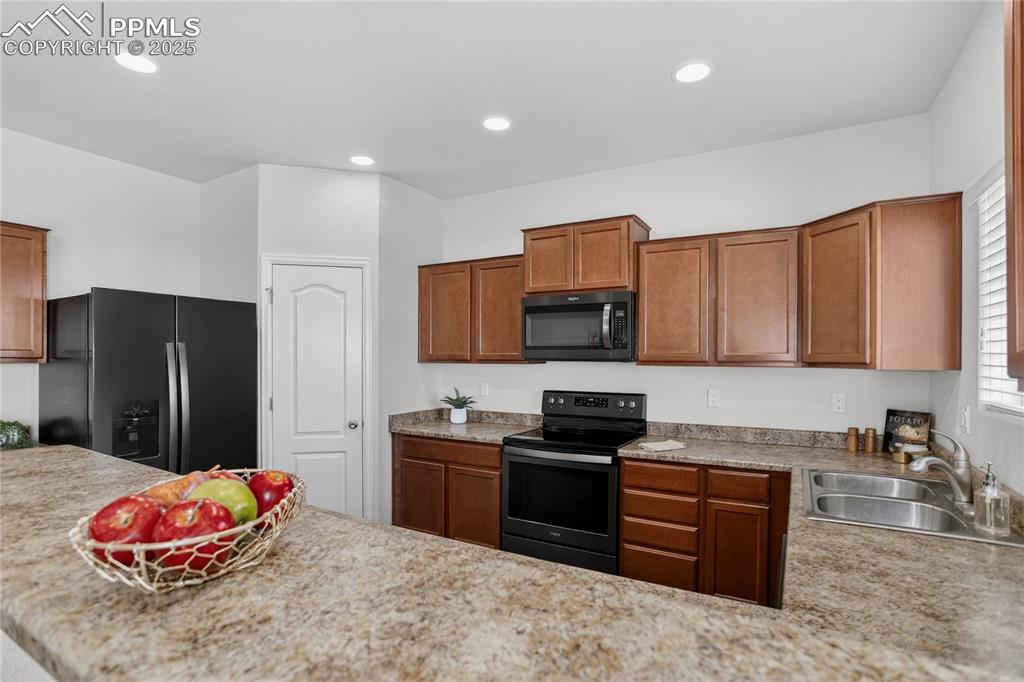 10179 Intrepid Way Colorado Springs, CO 80925 - Photo 7 of 20 Stone counters & pantry
