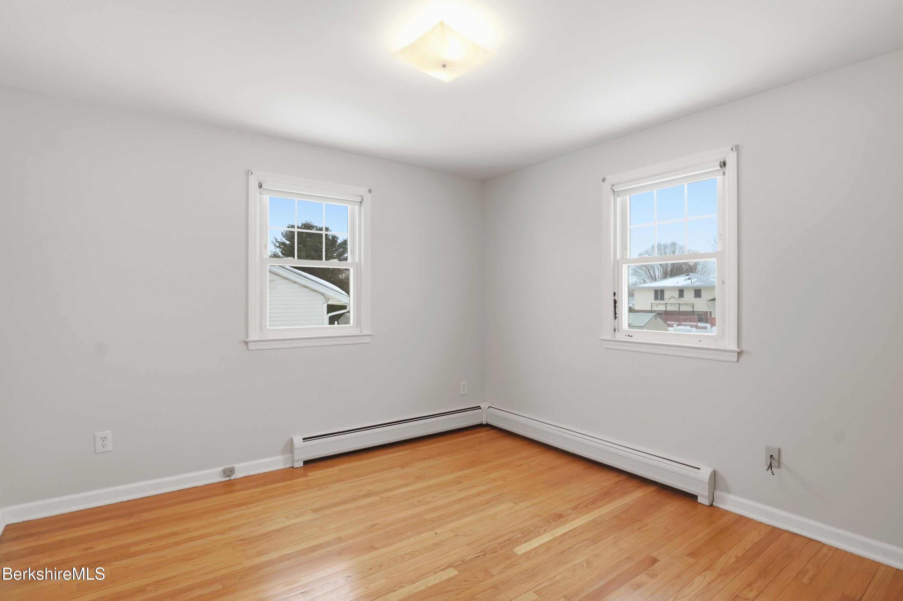 82 Quirico Drive Pittsfield, MA 01201 - Photo 16 of 30 a view of empty room with wooden floor