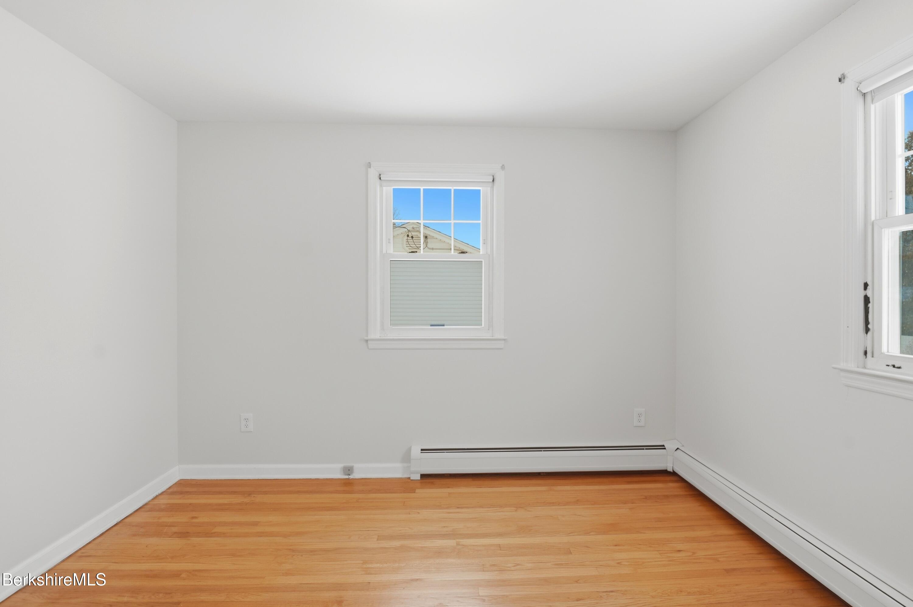 82 Quirico Drive Pittsfield, MA 01201 - Photo 18 of 30 a view of a room with wooden floor and white walls