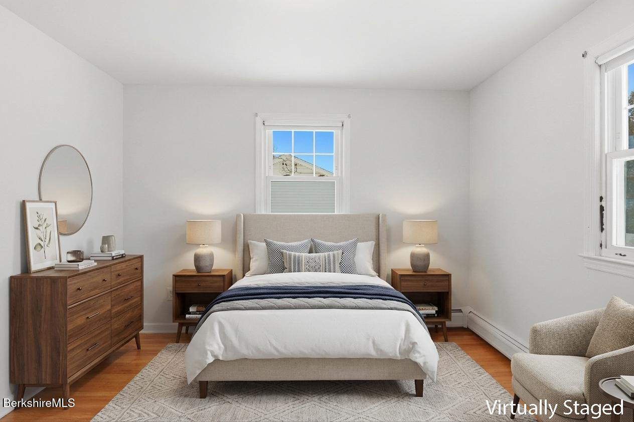 82 Quirico Drive Pittsfield, MA 01201 - Photo 19 of 30 a bedroom with a bed and a dresser