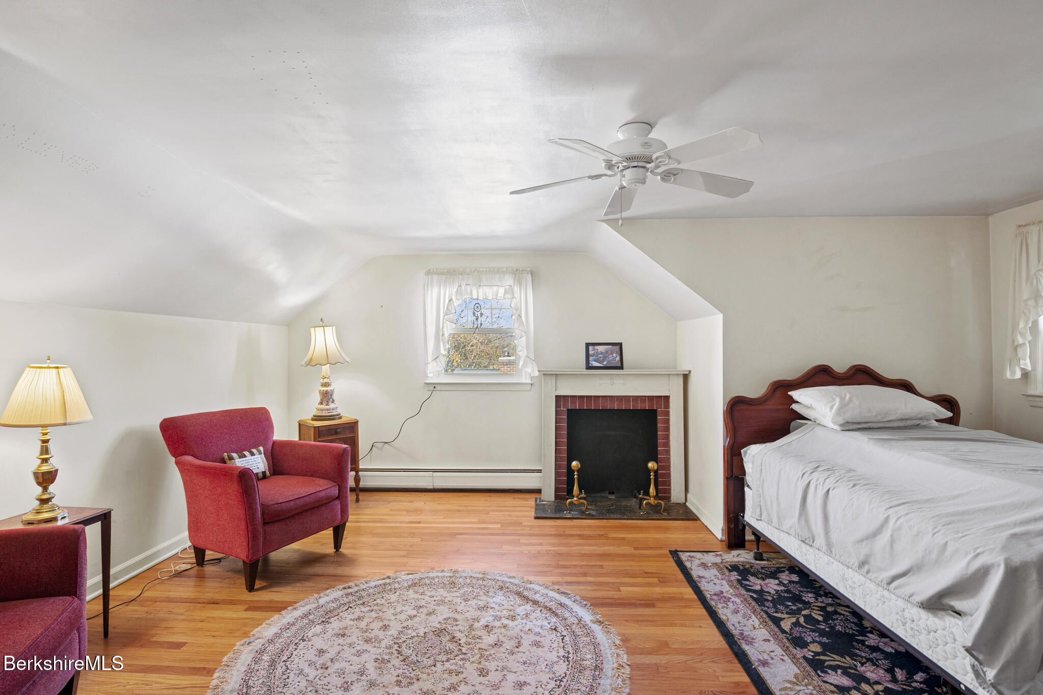 82 Quirico Drive Pittsfield, MA 01201 - Photo 20 of 30 a bedroom with furniture and a fireplace