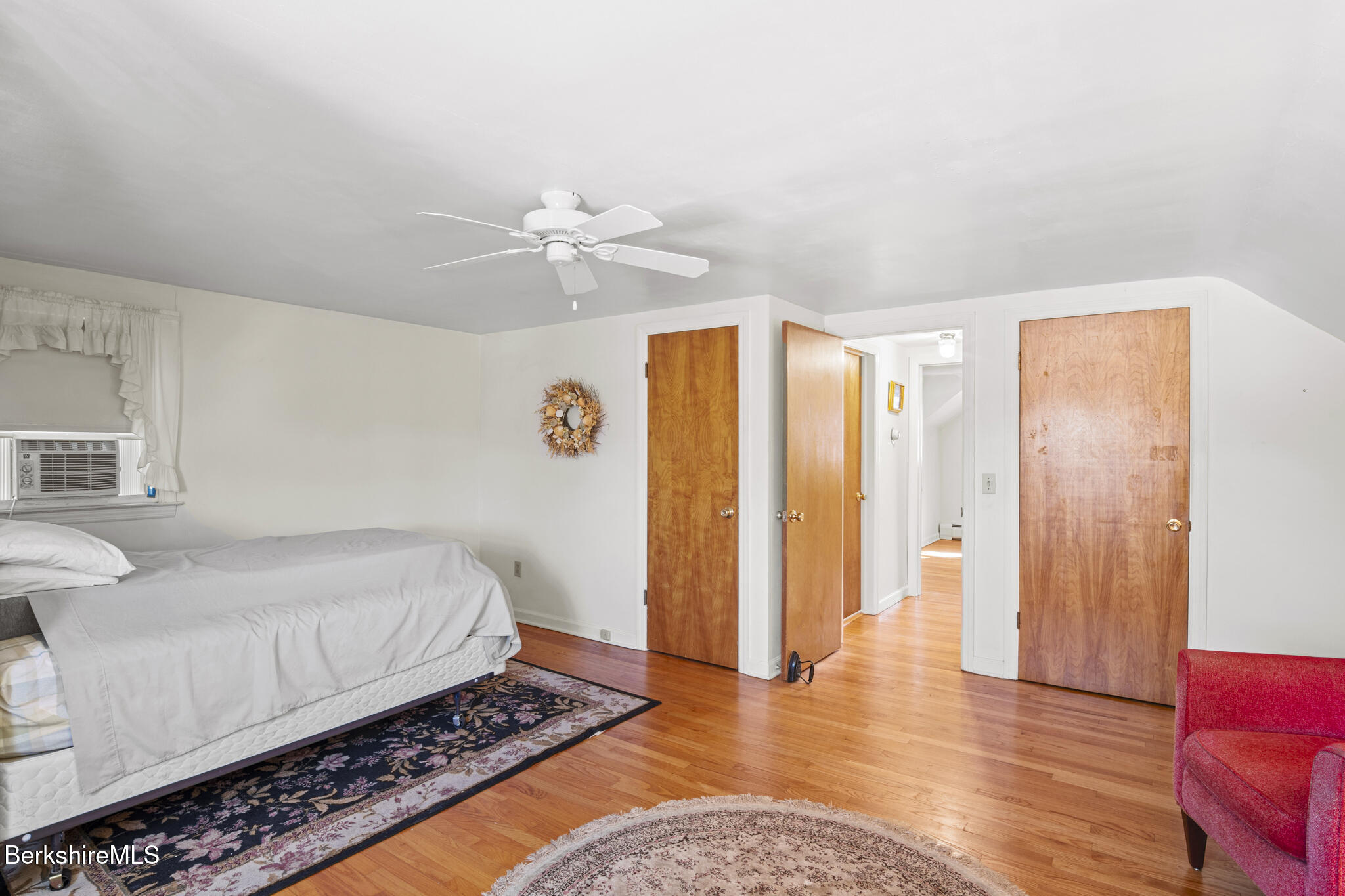 82 Quirico Drive Pittsfield, MA 01201 - Photo 21 of 30 a bedroom with a bed dresser and a window