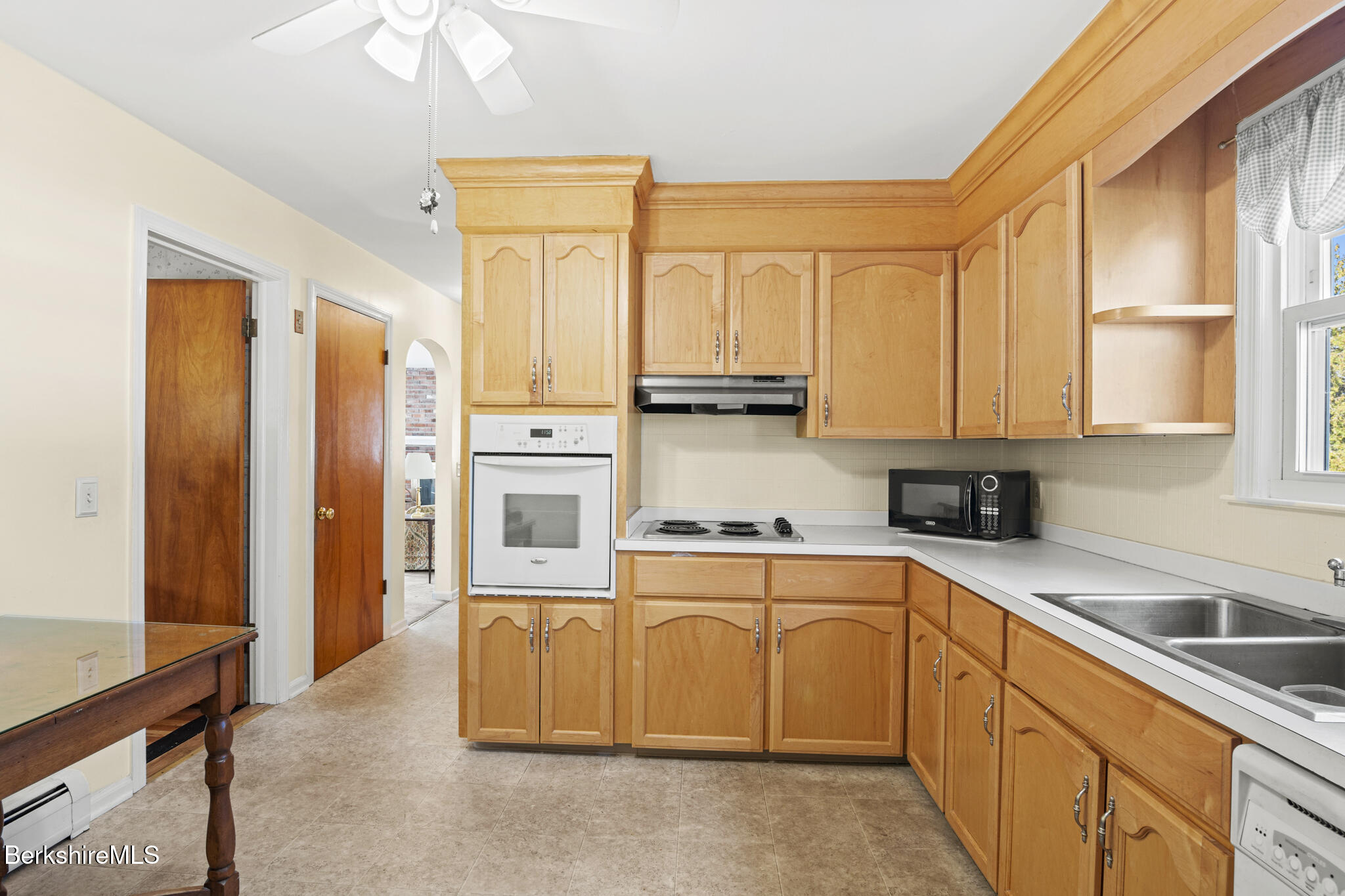 82 Quirico Drive Pittsfield, MA 01201 - Photo 6 of 30 a kitchen with stainless steel appliances granite countertop a refrigerator sink and cabinets