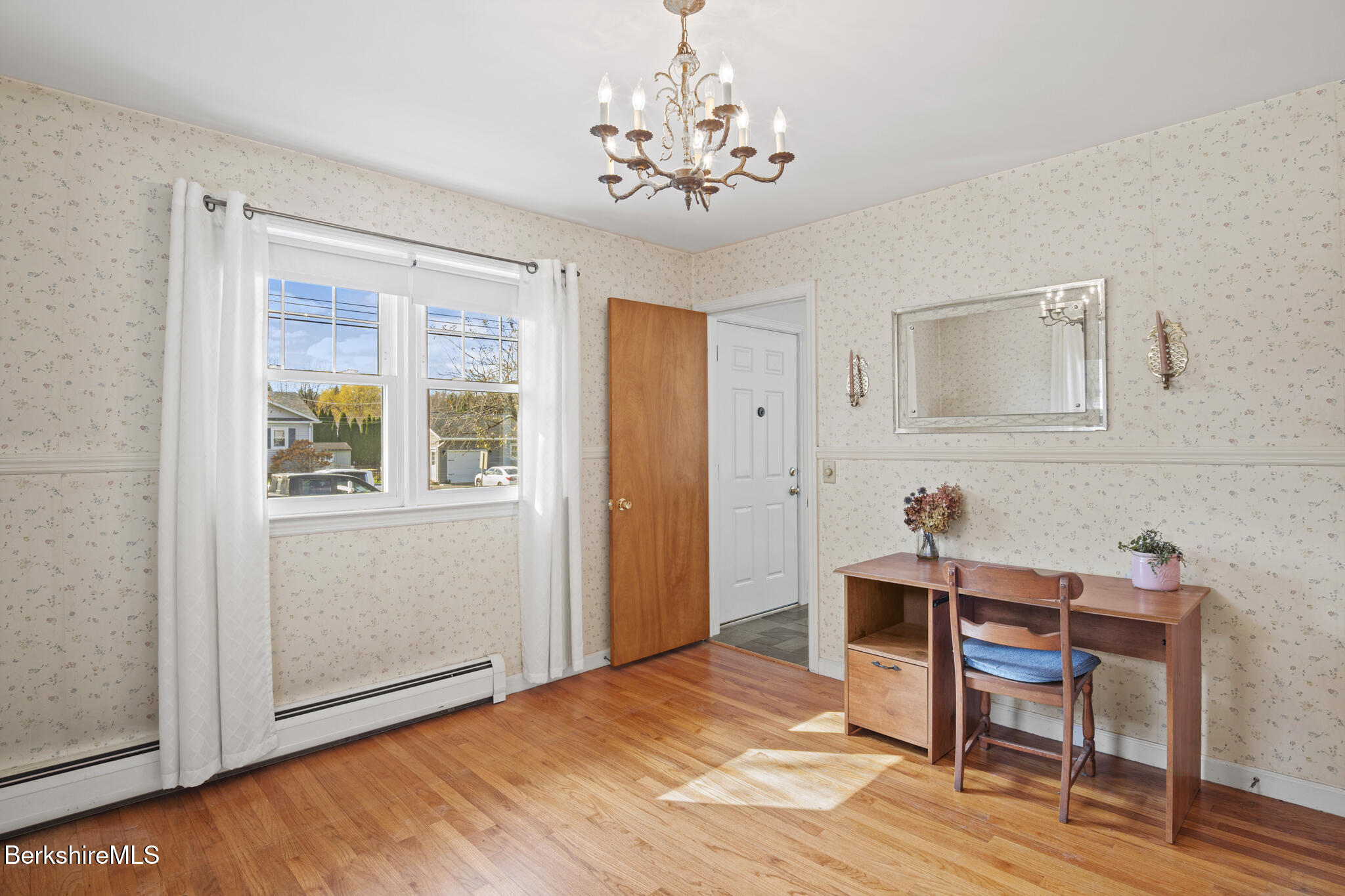 82 Quirico Drive Pittsfield, MA 01201 - Photo 9 of 30 a workspace room with a bed and a chandelier