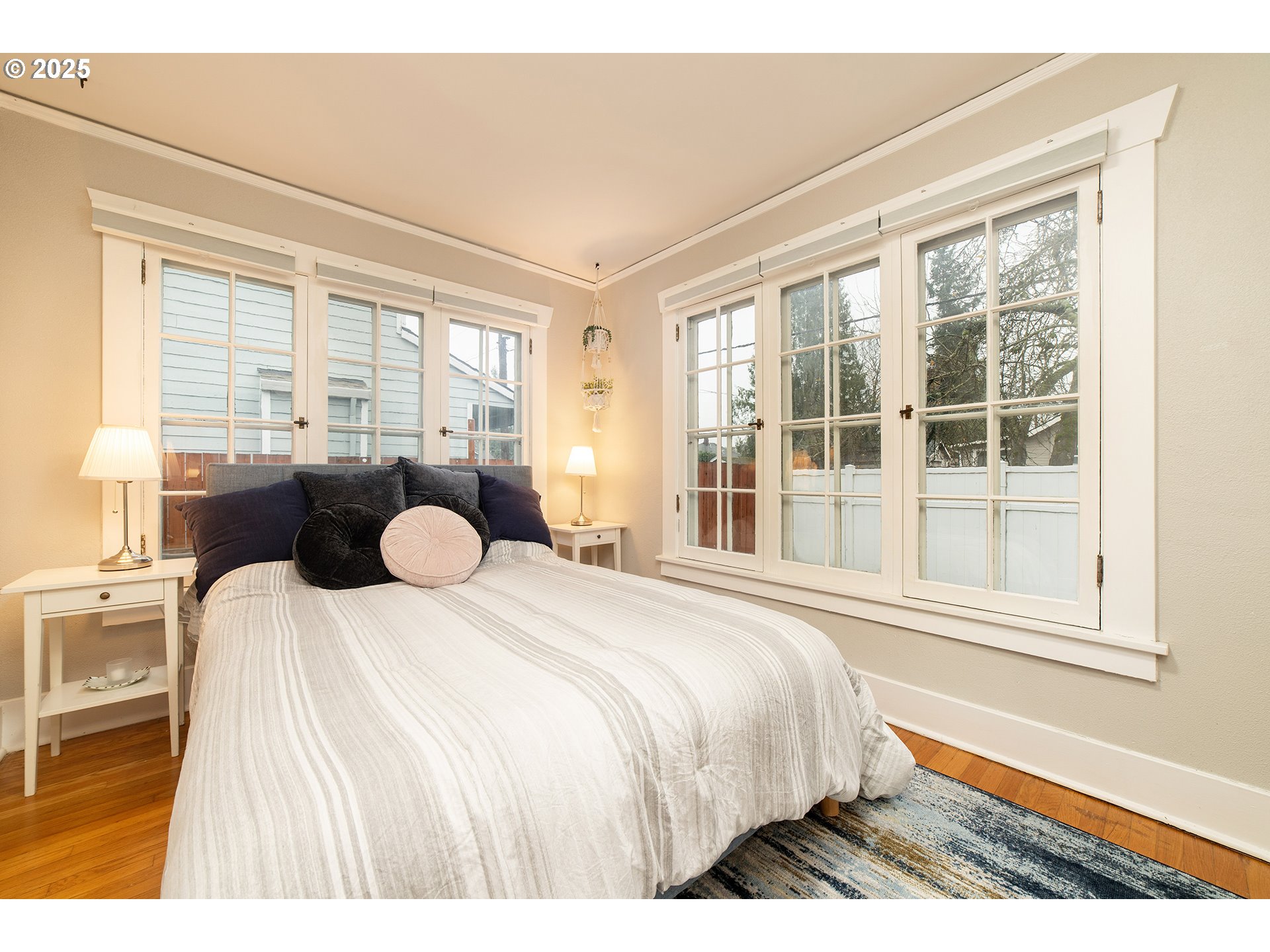 3506 Northeast 78th Avenue Portland, OR 97213 - Photo 11 of 41 a spacious bedroom with a bed and a large window
