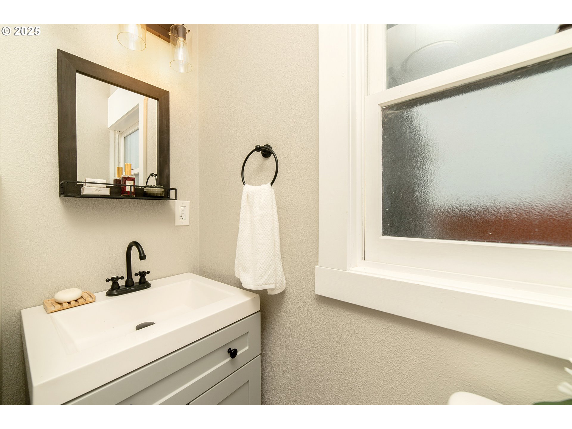 3506 Northeast 78th Avenue Portland, OR 97213 - Photo 16 of 41 a bathroom with a sink a mirror and a bathtub