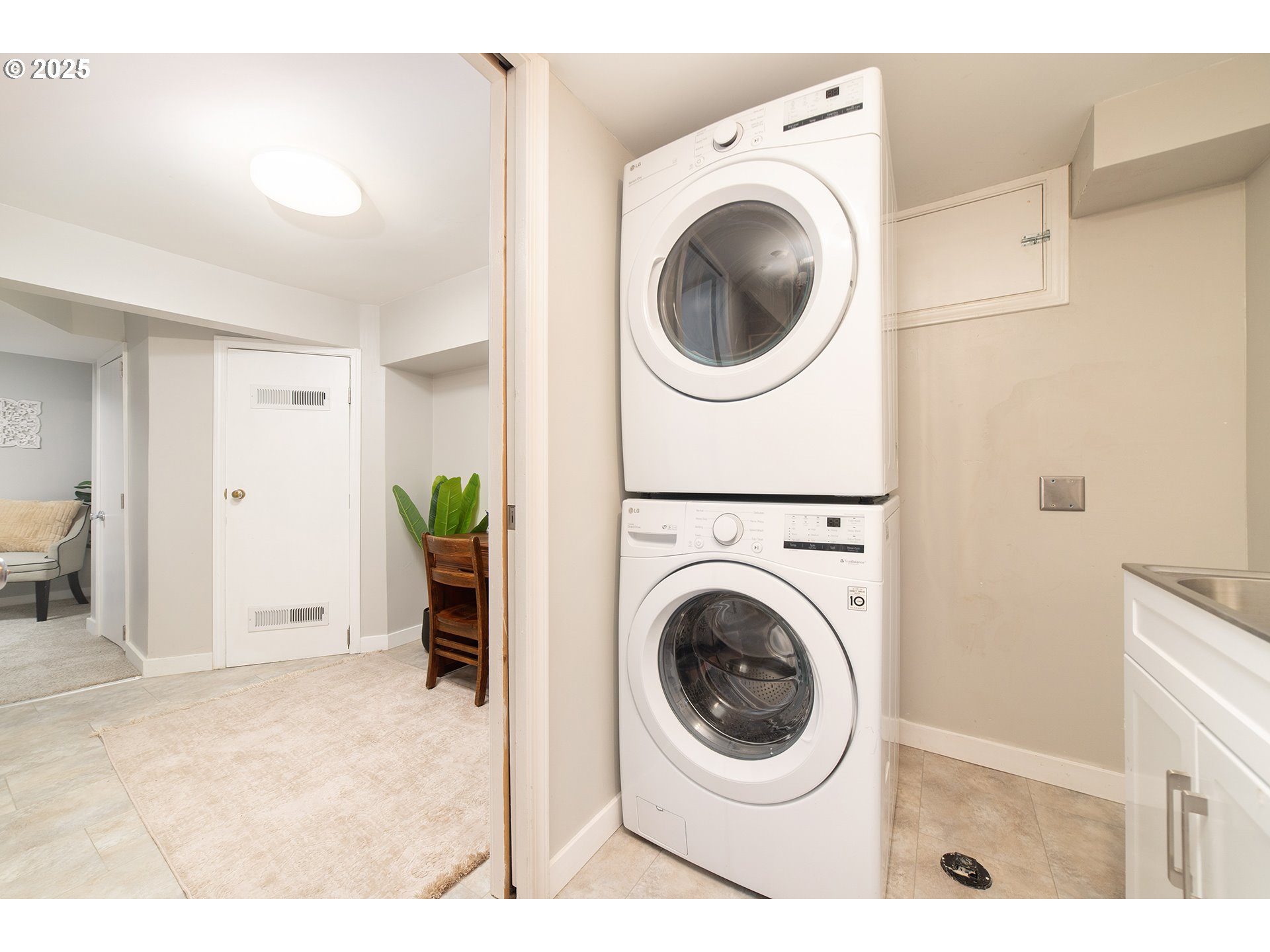3506 Northeast 78th Avenue Portland, OR 97213 - Photo 18 of 41 a view of a hallway with washer and dryer