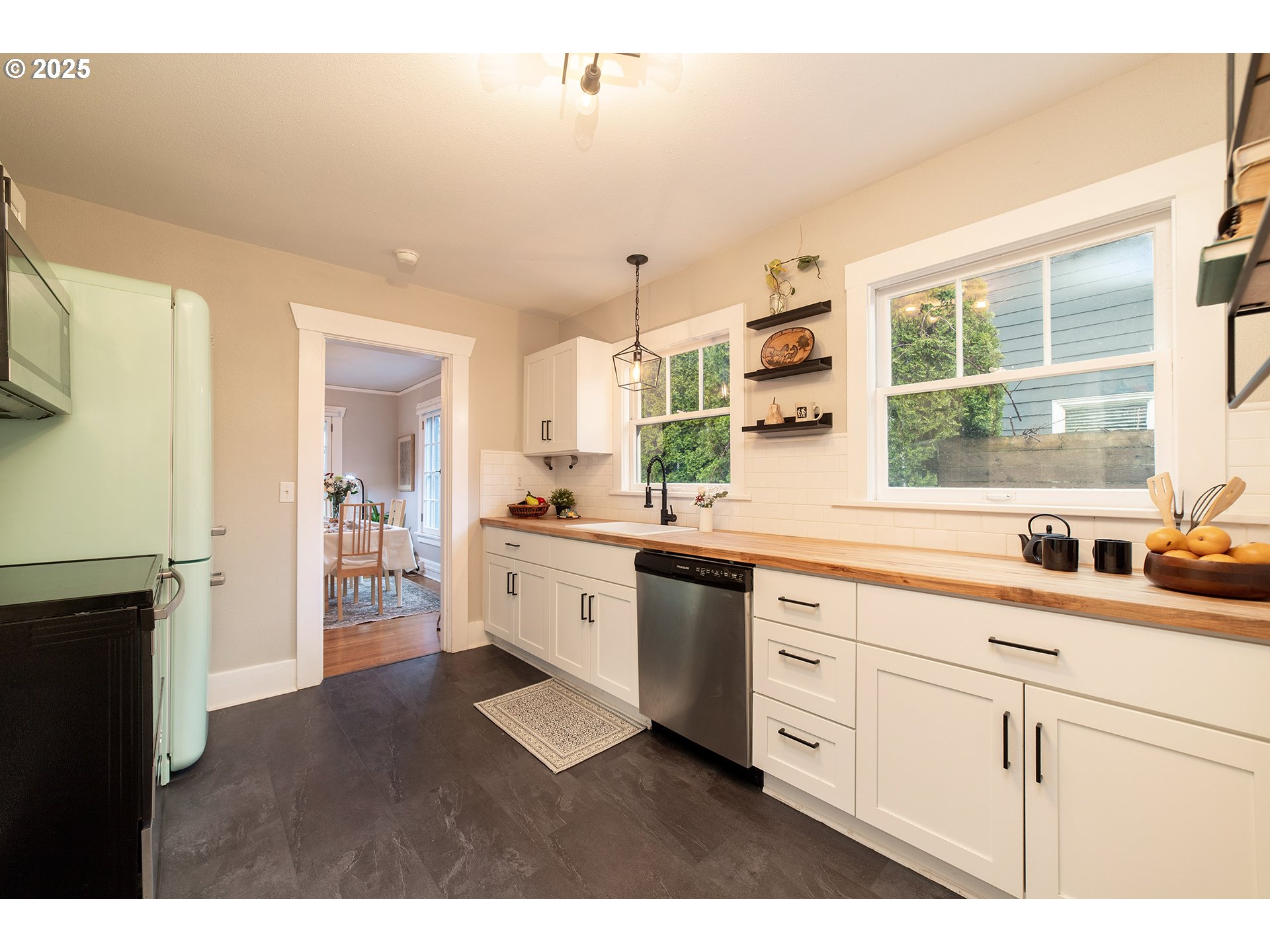 3506 Northeast 78th Avenue Portland, OR 97213 - Photo 8 of 41 a kitchen with kitchen island white cabinets and white appliances