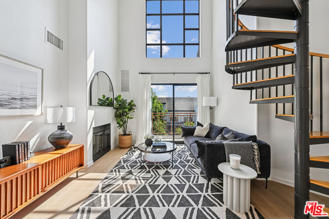 290 North Hudson Avenue, Unit 403W Pasadena, CA 91101 - Photo 14 of 25 a living room with furniture and a floor to ceiling window or wooden floor