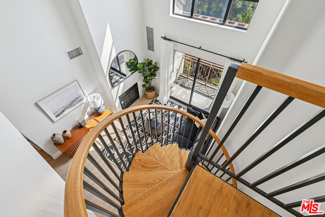 290 North Hudson Avenue, Unit 403W Pasadena, CA 91101 - Photo 16 of 25 a view of stairs and a front door