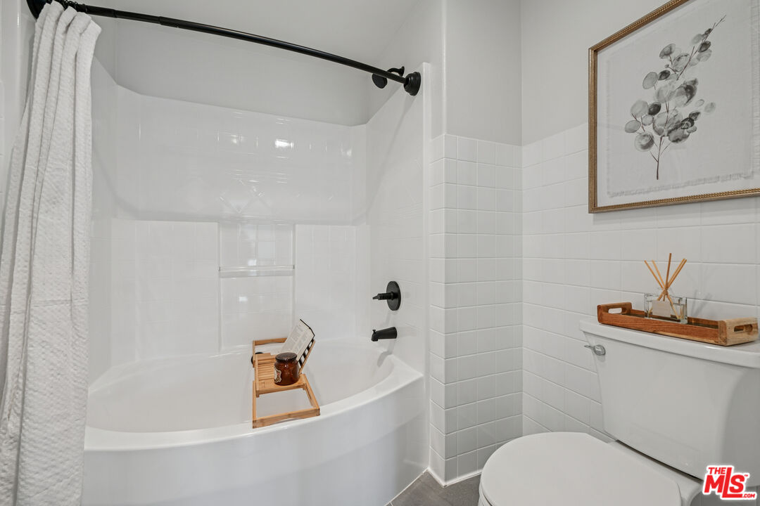 290 North Hudson Avenue, Unit 403W Pasadena, CA 91101 - Photo 10 of 25 a white bath tub sitting next to a white toilet