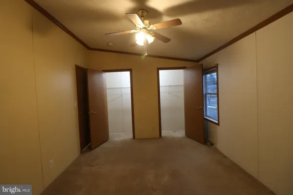 a view of empty room with windows