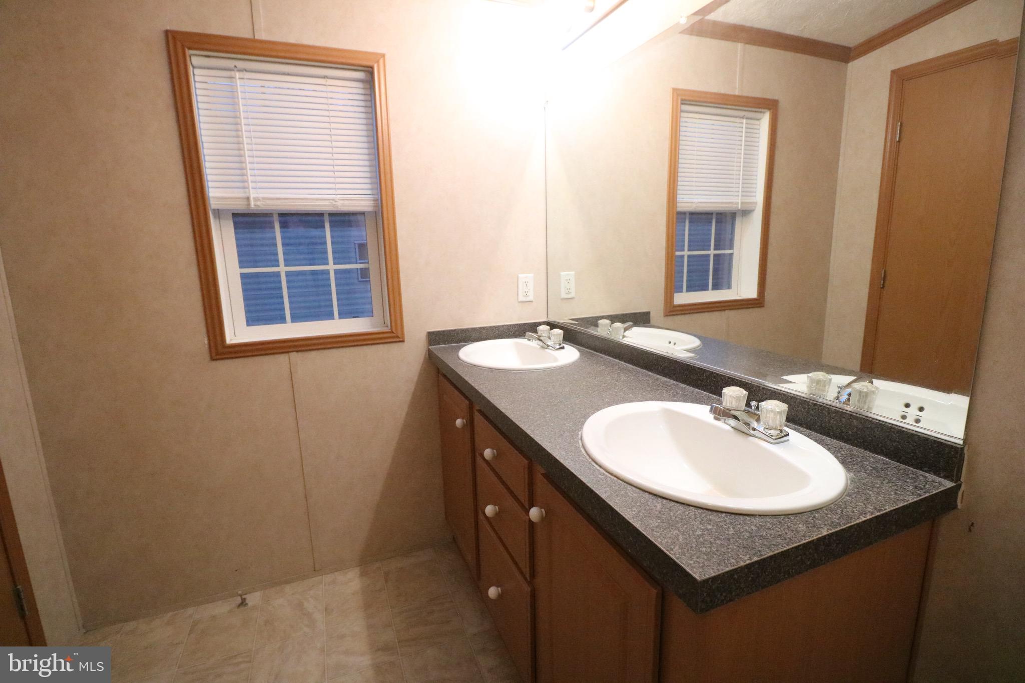 118 Conestoga Road Middle River, MD 21220 - Photo 25 of 38 a bathroom with a sink and a mirror
