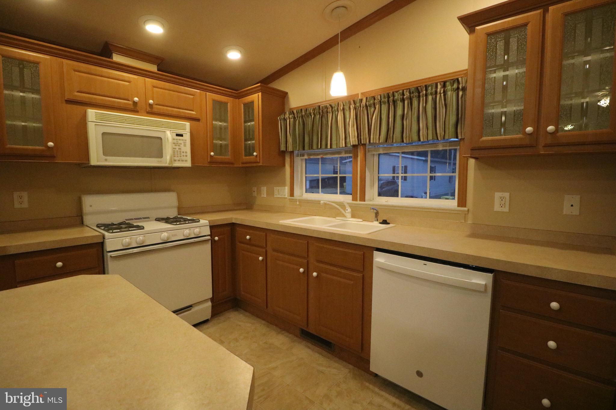 118 Conestoga Road Middle River, MD 21220 - Photo 4 of 38 a kitchen with a sink and cabinets