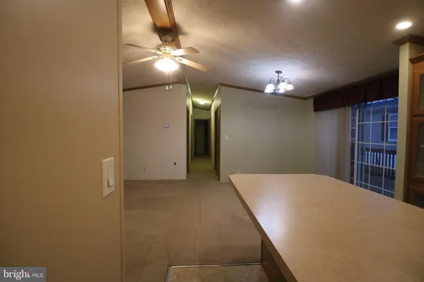 a view of a livingroom and entryway