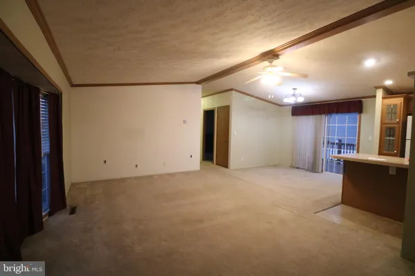 a view of an empty room with a cabinet