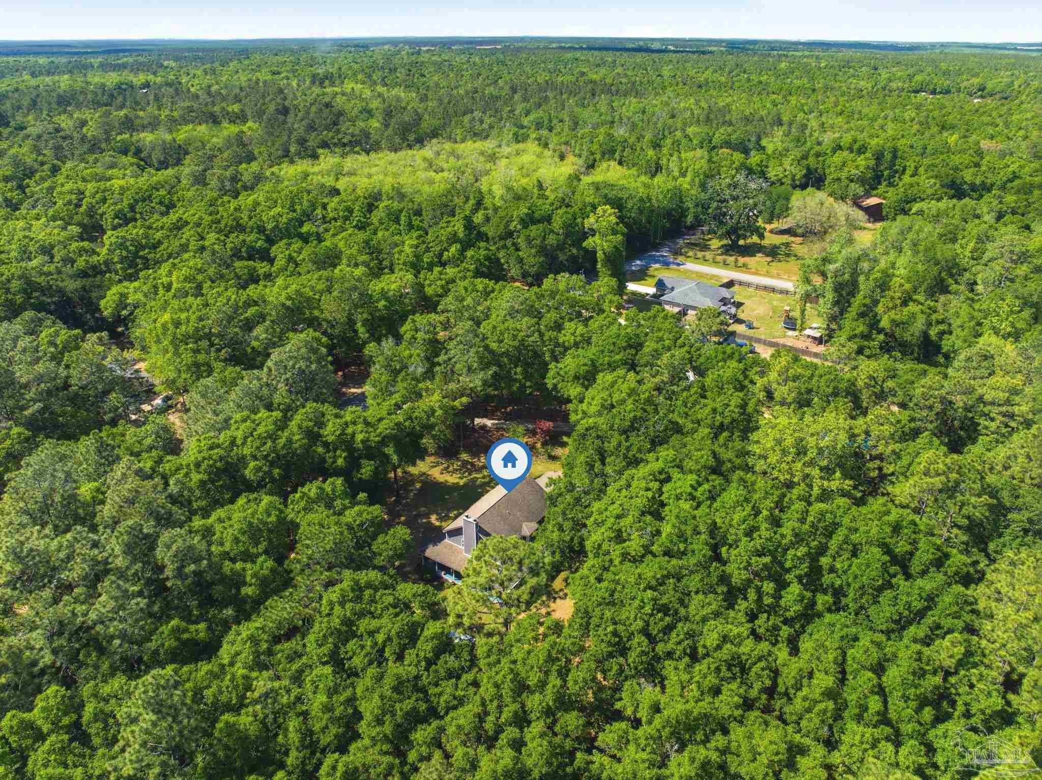6930 Summit Way Milton, FL 32570 - Photo 57 of 71 a view of a forest with a houses