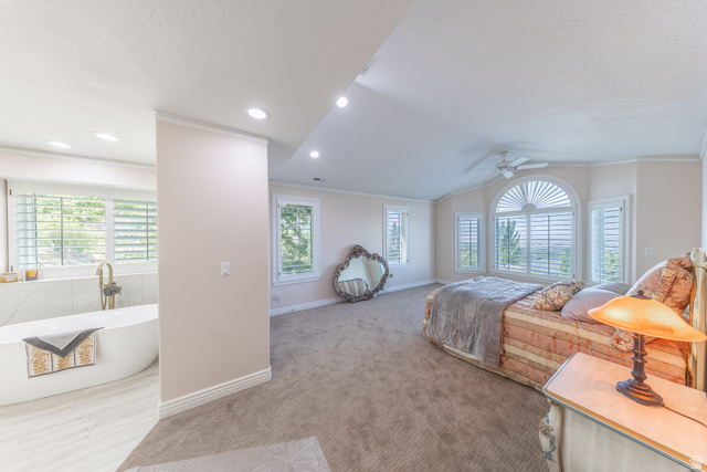 144 Bountiful Boulevard Bountiful, UT 84010 - Photo 17 of 28 Bedroom with crown molding, light carpet, and ceiling fan