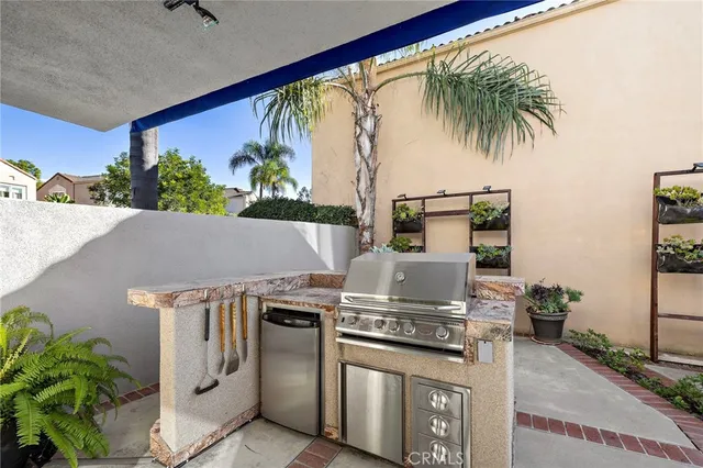 a view of house with outdoor seating and deck