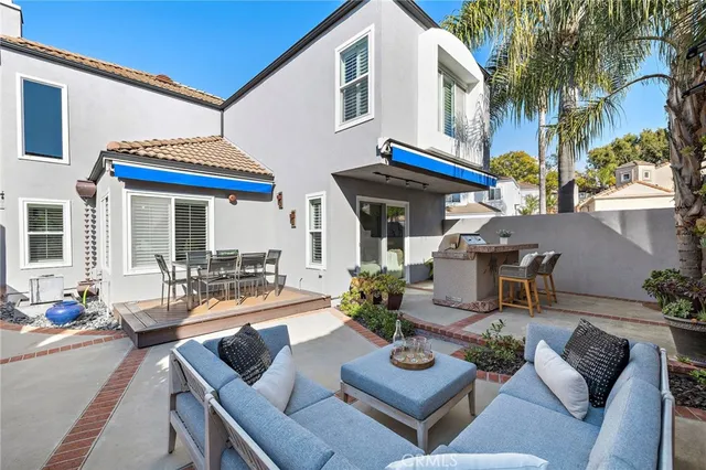 a view of a chair and table in the patio