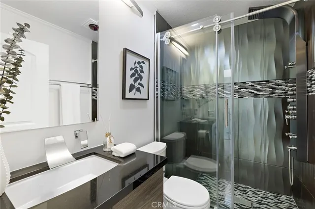 a bedroom with a bed and a couch