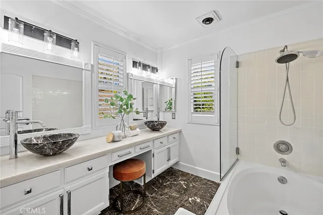 a view of kitchen with stainless steel appliances and cabinets