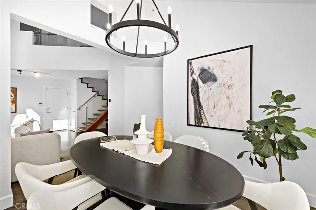 a view of a dining room with furniture and a potted plant