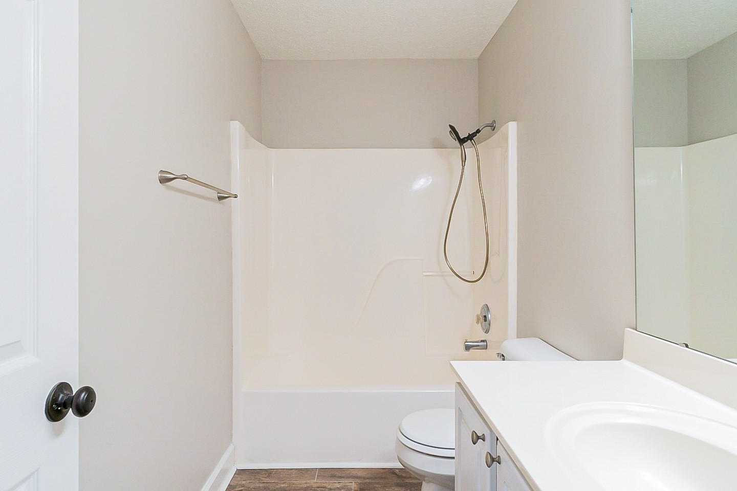 1604 Comanche Run Madison, TN 37115 - Photo 14 of 32 a bathroom with a granite countertop toilet sink and shower