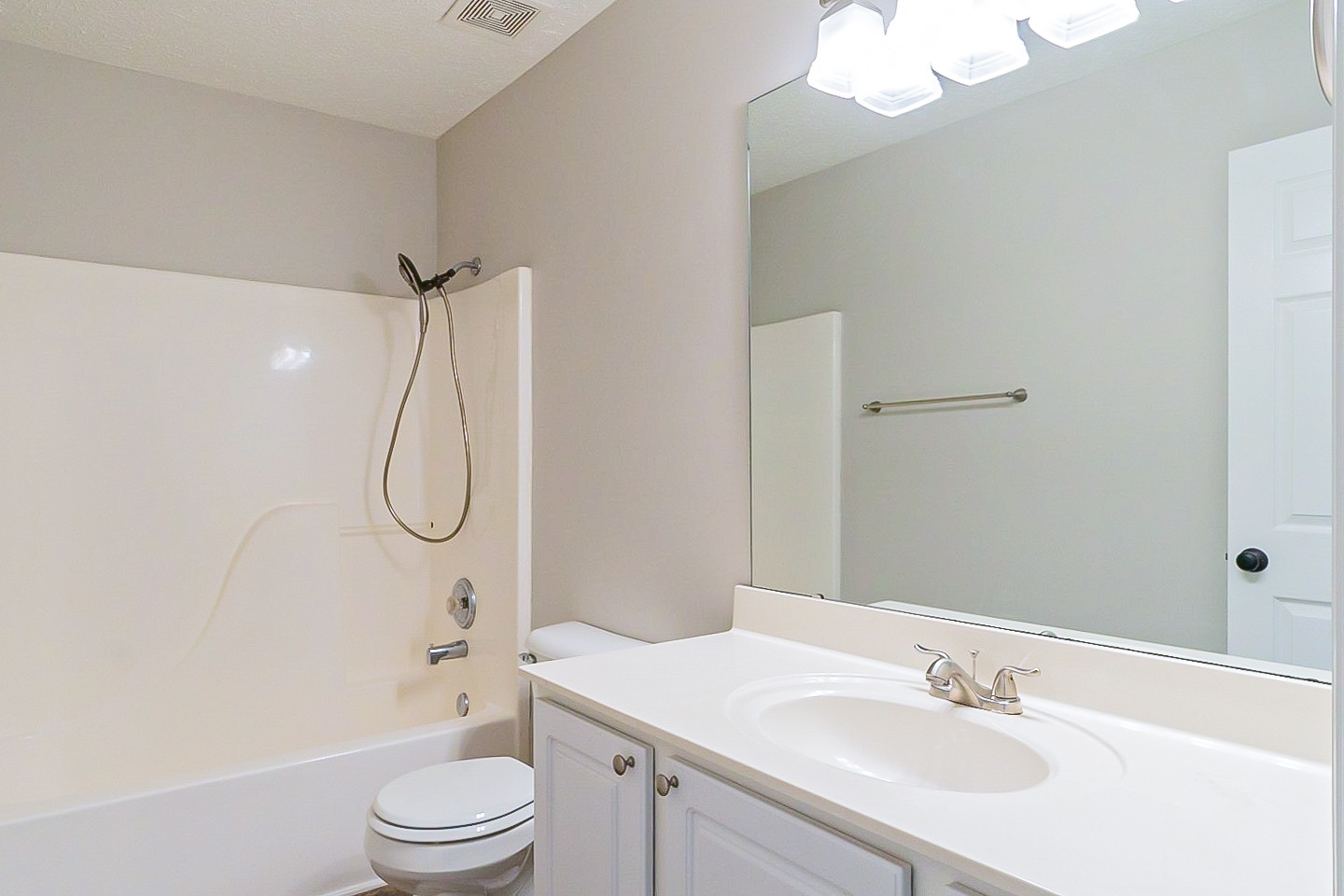 1604 Comanche Run Madison, TN 37115 - Photo 15 of 32 a bathroom with a sink a toilet a mirror and shower