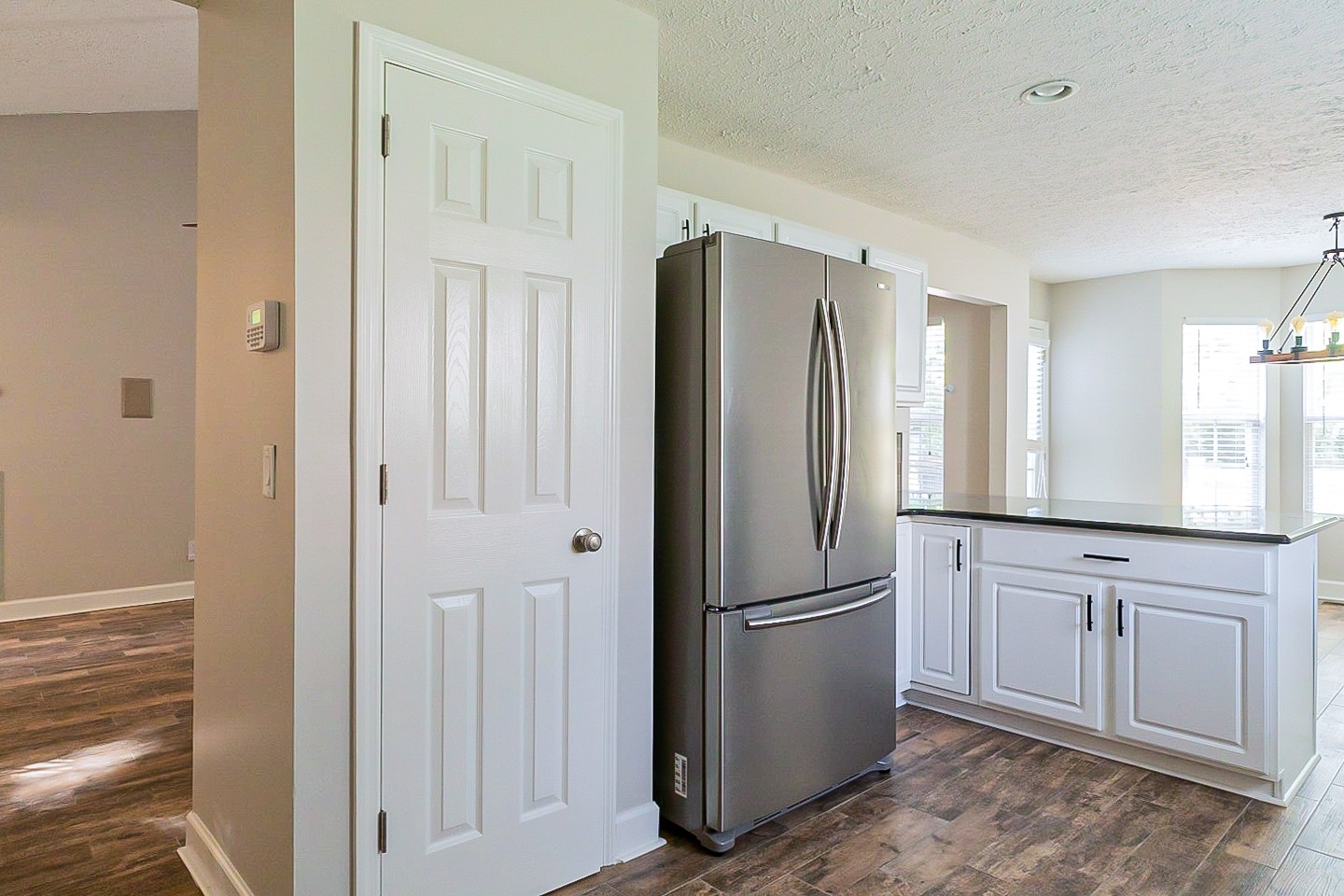 1604 Comanche Run Madison, TN 37115 - Photo 10 of 32 a kitchen with stainless steel appliances granite countertop a refrigerator and a sink