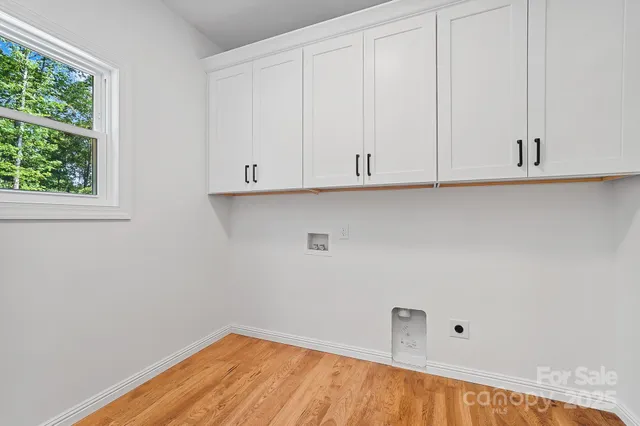 a view of a living room and floor to ceiling window