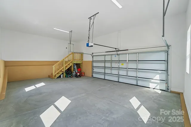 a view of a balcony with wooden floor and iron fence