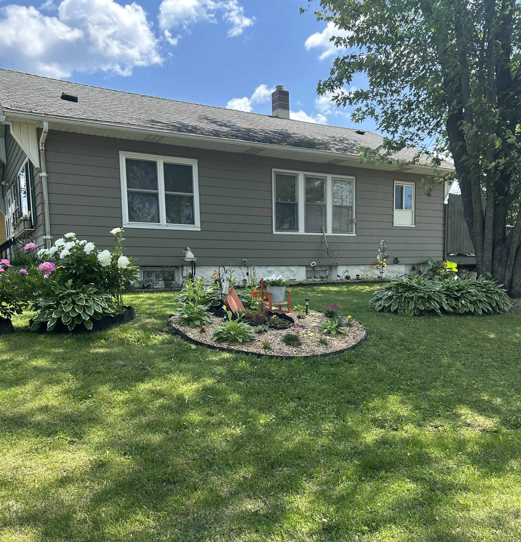 630 2nd Street Proctor, MN 55810 - Photo 23 of 28 View of side of home featuring a yard, a chimney, and a shingled roof