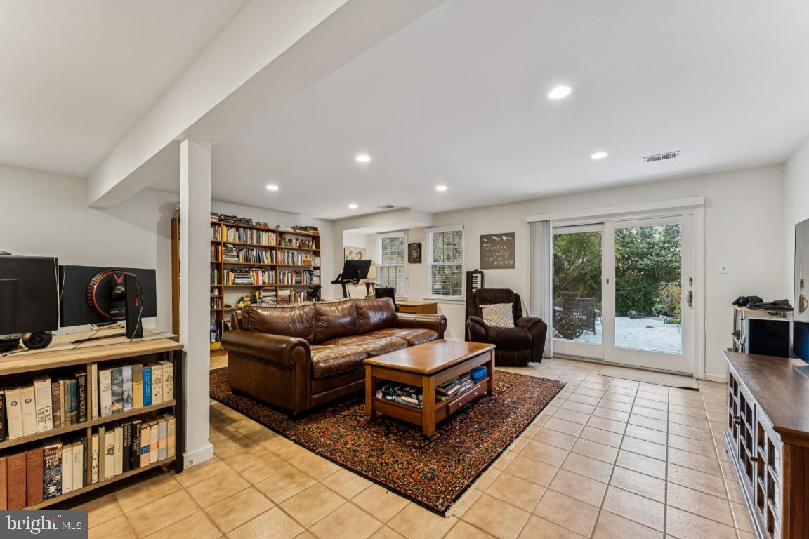3559 Hamlet Place Chevy Chase, MD 20815 - Photo 16 of 26 a living room with furniture or couch and a bookshelf